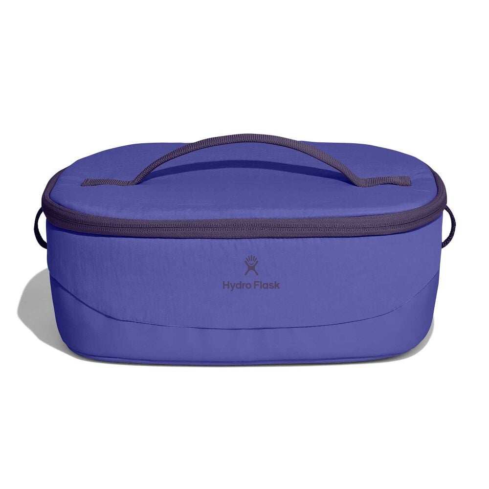 Purple Hydro Flask insulated lunch tote with oval shape, zip-around lid, top carry handle, small side handles, logo, and slightly textured finish with darker trim.