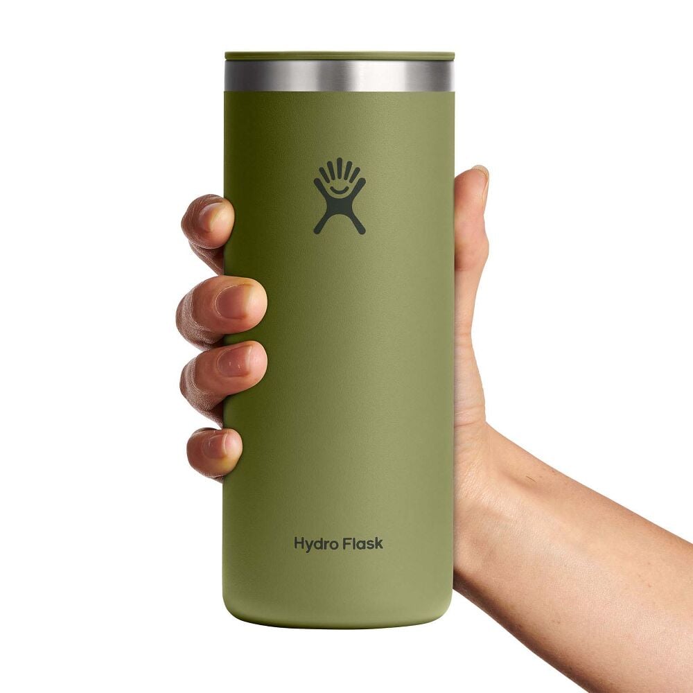 Green Hydro Flask insulated tumbler with matte finish, stainless steel rim, built-in sip lid, and Hydro Flask logo with brand name near base. White background.