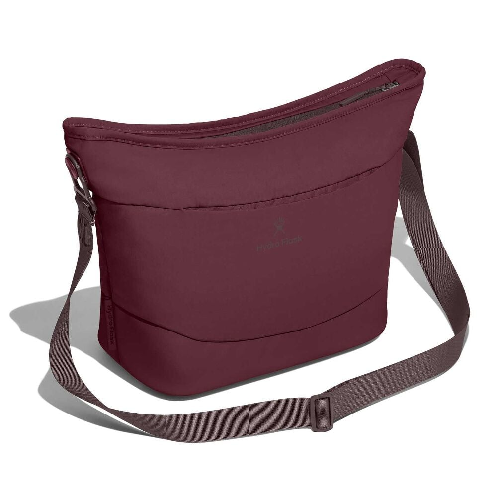 Maroon Hydro Flask shoulder bag with curved top, long adjustable gray strap with metal hardware, small zipper pocket, padded exterior, and darker bottom panel.