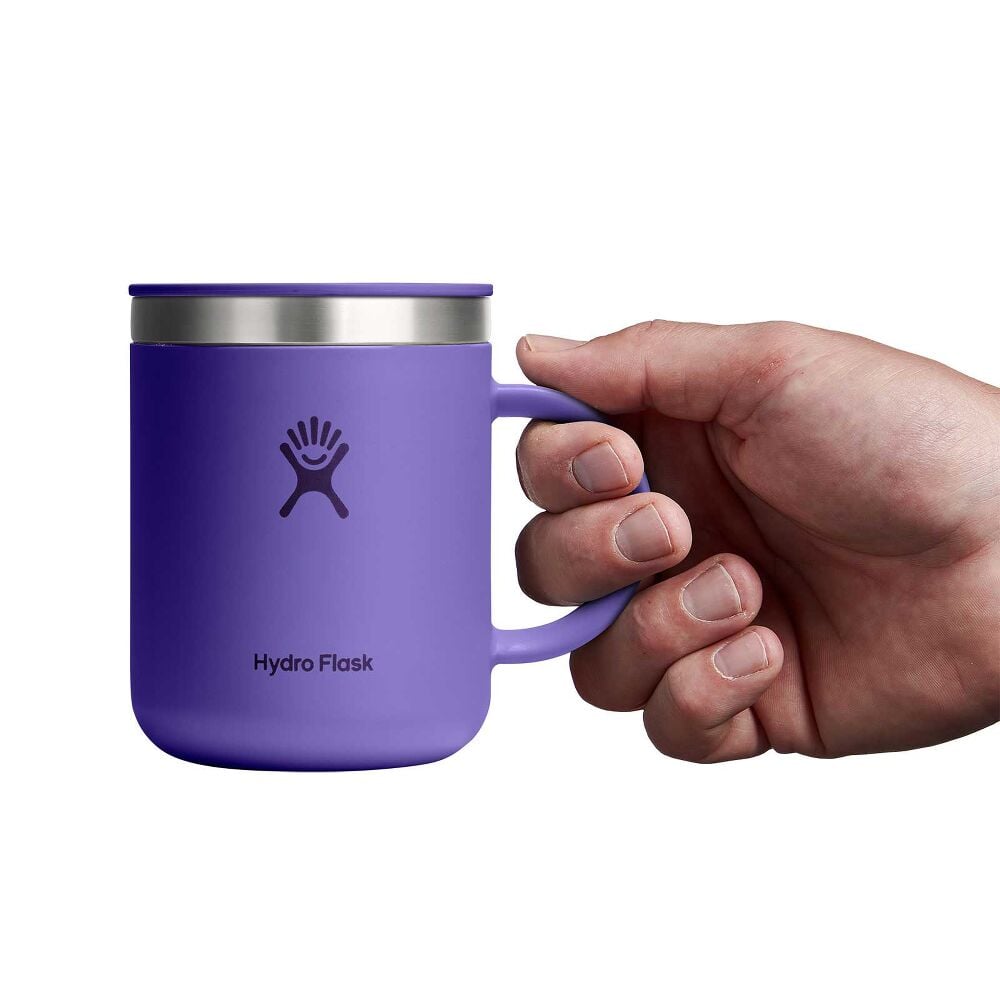 Purple Hydro Flask insulated mug with handle, matching sip lid, stainless steel rim accent, and Hydro Flask logo on front. Matte finish on white background.