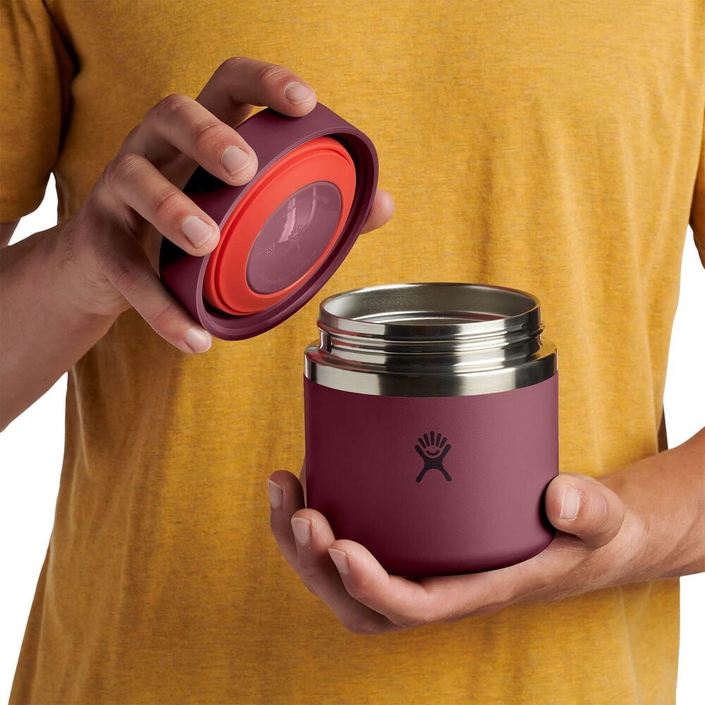 Maroon Hydro Flask cylindrical insulated food jar with matte finish, wide flat screw-on lid, brushed stainless-steel band on upper body, and Hydro Flask logo on front.