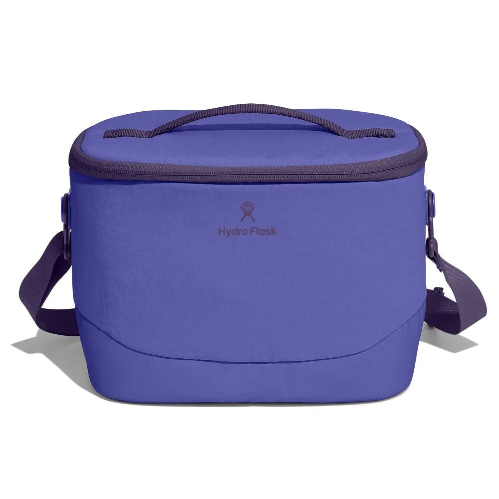Purple Hydro Flask soft-sided cooler bag with oval zippered lid, matching top handle, detachable shoulder strap with plastic hardware, and smooth structured body.