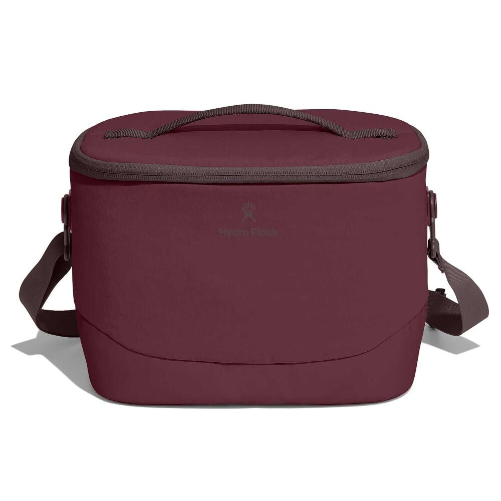 Maroon Hydro Flask insulated soft cooler with oval shape, zippered lid, short top handle, adjustable shoulder strap, and gray trim around zipper and handle.