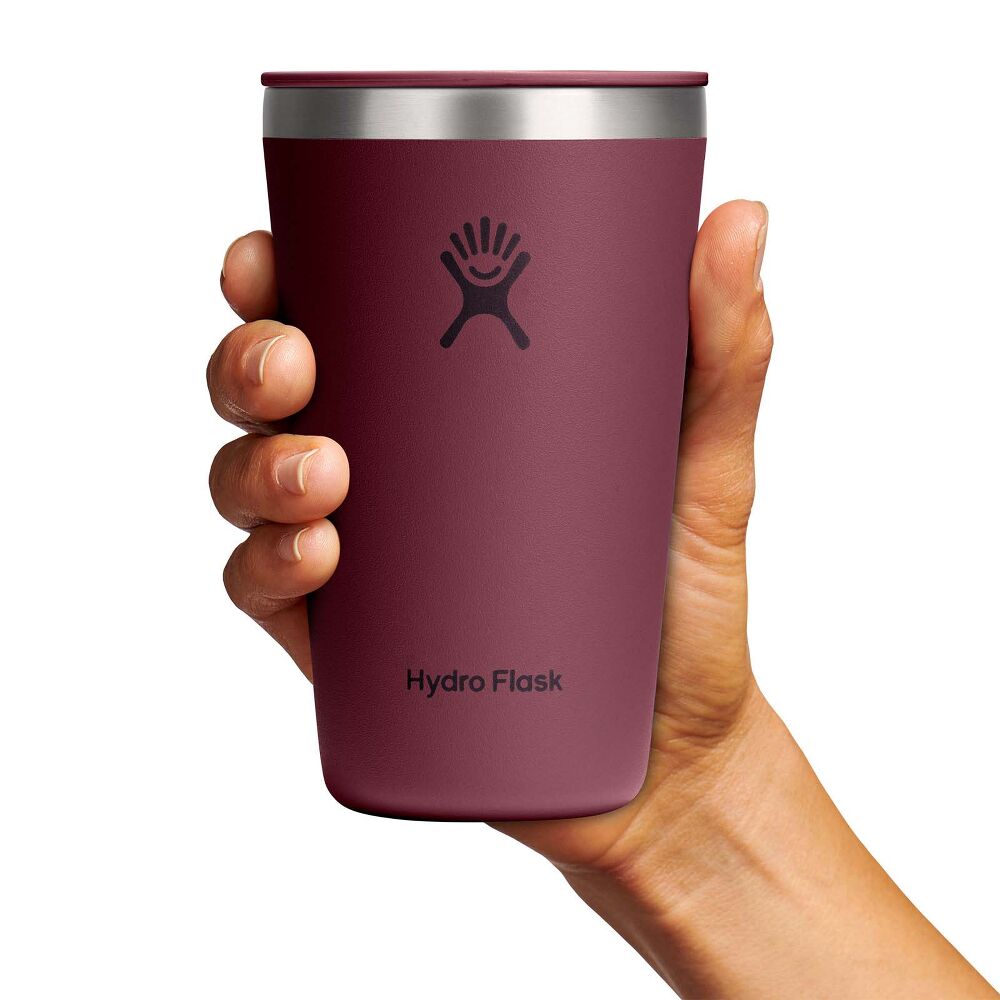Maroon Hydro Flask insulated tumbler with stainless-steel rim, matching lid with sip slider, smooth matte tapered finish, and Hydro Flask logo on front.