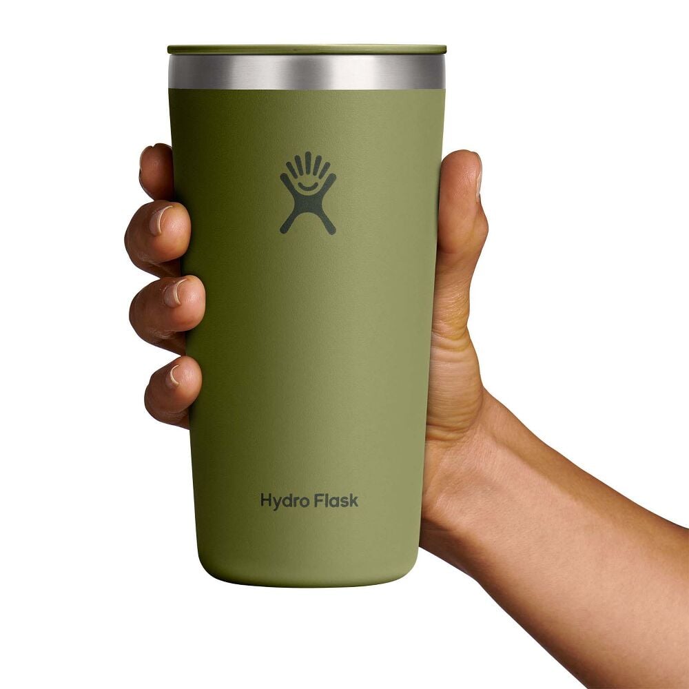 Olive-green Hydro Flask insulated tumbler with lid, stainless steel rim, flip-style sip opening, matte textured finish, and Hydro Flask logo on front.