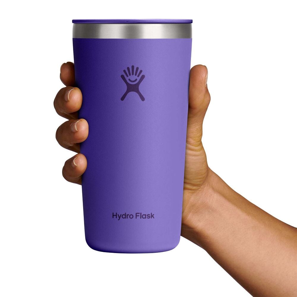 Purple Hydro Flask insulated tumbler with lid, stainless-steel rim, sip opening, matte finish, and Hydro Flask logo centered on front.