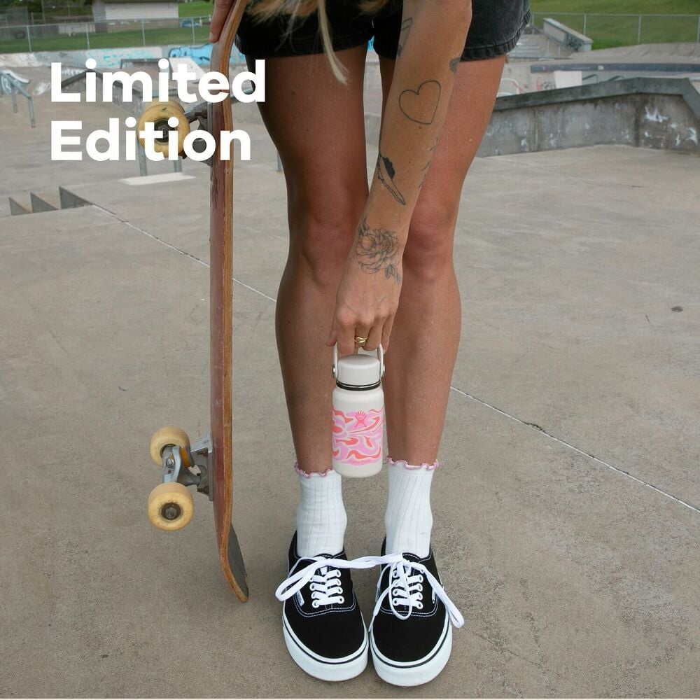 Woman outside holding skateboard and Hydro Flask mini bottle with Callie Groove design and text overlay stating Limited Edition