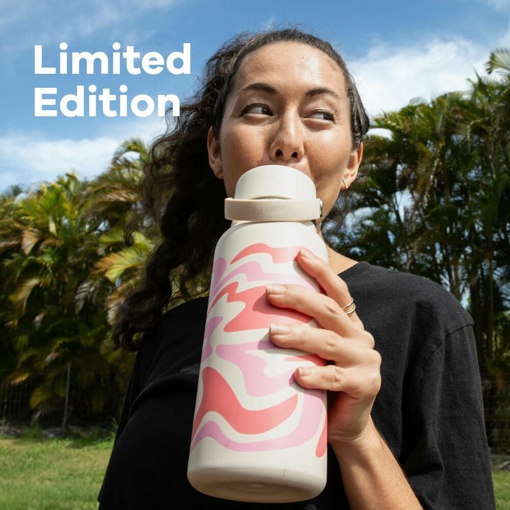 Woman outside holding Hydro Flask bottle with limited edition Callie Groove design and text overlay stating Limited Edition